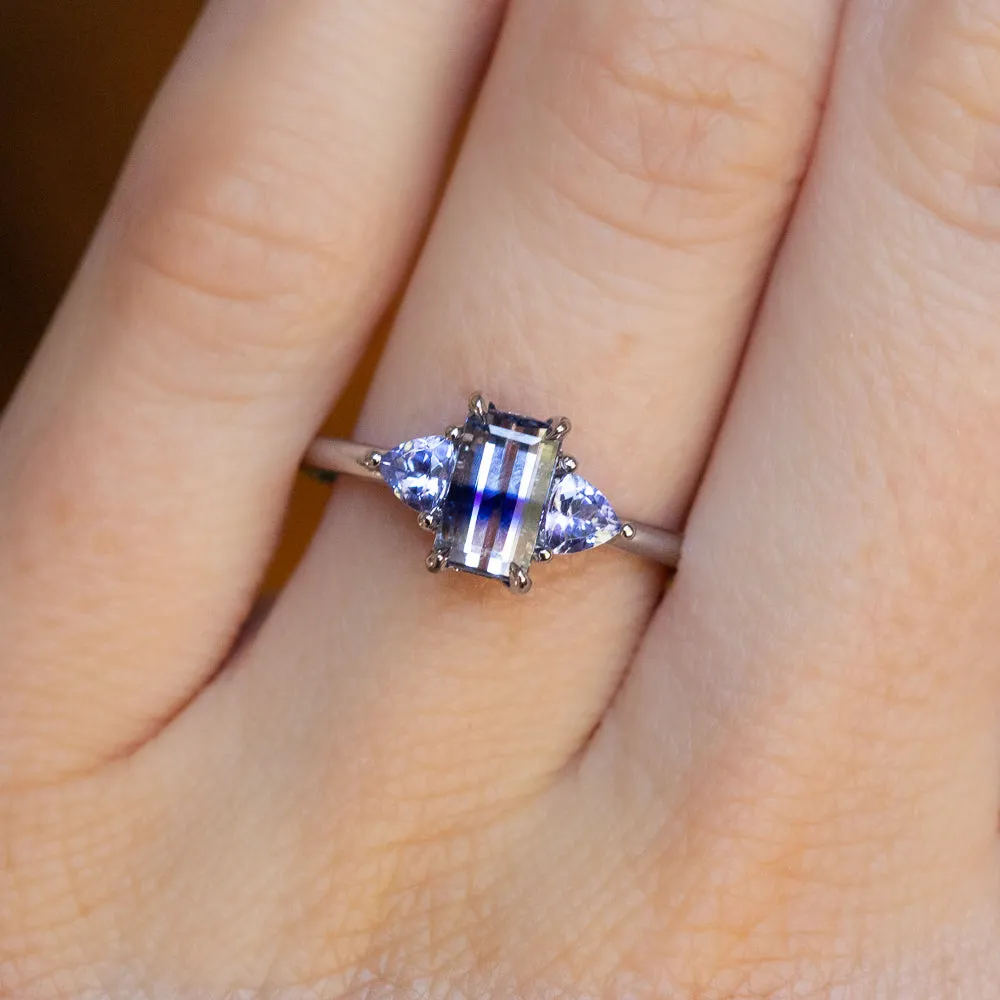 1.11ct Bicolor Emerald Cut Sapphire Three Stone Ring with Tanzanite Trillion Side Stones in Platinum