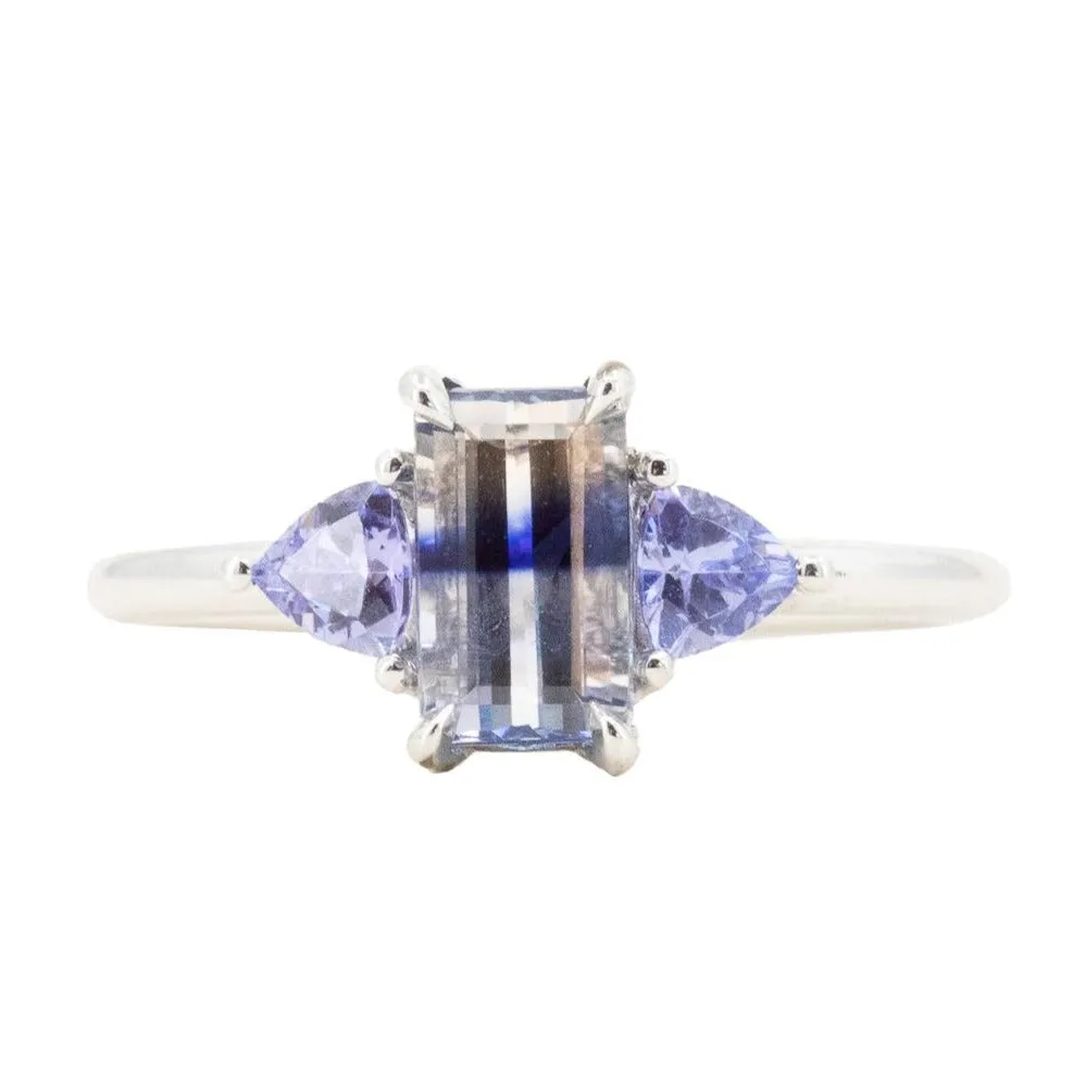 1.11ct Bicolor Emerald Cut Sapphire Three Stone Ring with Tanzanite Trillion Side Stones in Platinum