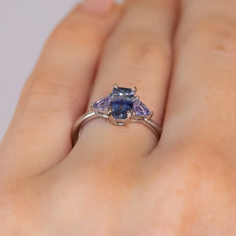 1.11ct Bicolor Emerald Cut Sapphire Three Stone Ring with Tanzanite Trillion Side Stones in Platinum